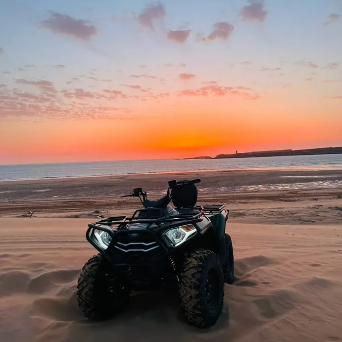 Pink light over the beach at the end of a ride