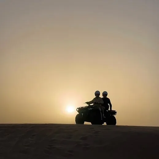 Silhouette on the dune crest at sunset